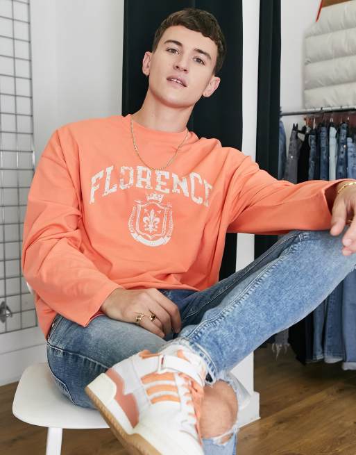 ASOS DESIGN - T-shirt oversize a maniche lunghe arancione con scritta 