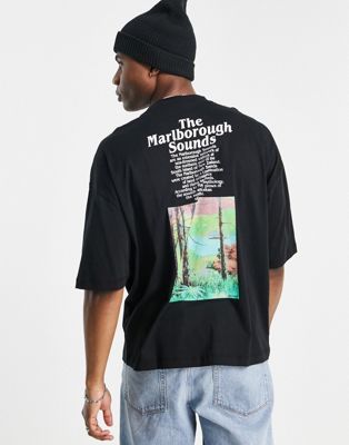 T-shirts imprimés T-shirt oversize avec imprimé photo floral sur la poitrine et au dos - Noir