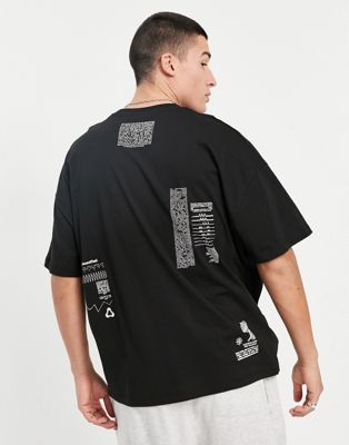 Nouveau T-shirt oversize avec texte imprimé à placements multiples - Noir