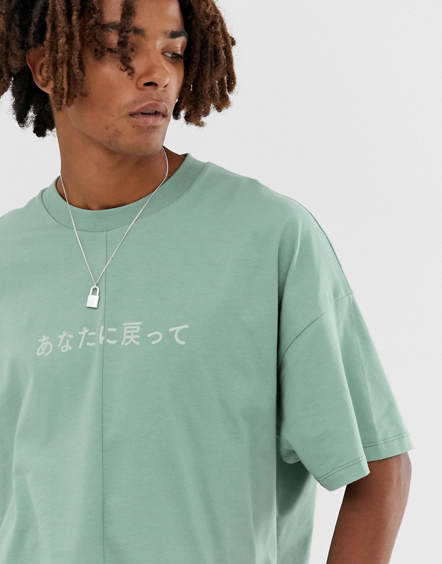 ASOS DESIGN - T-shirt oversize in jersey pesante con cucitura centrale e stampa sul petto-Verde