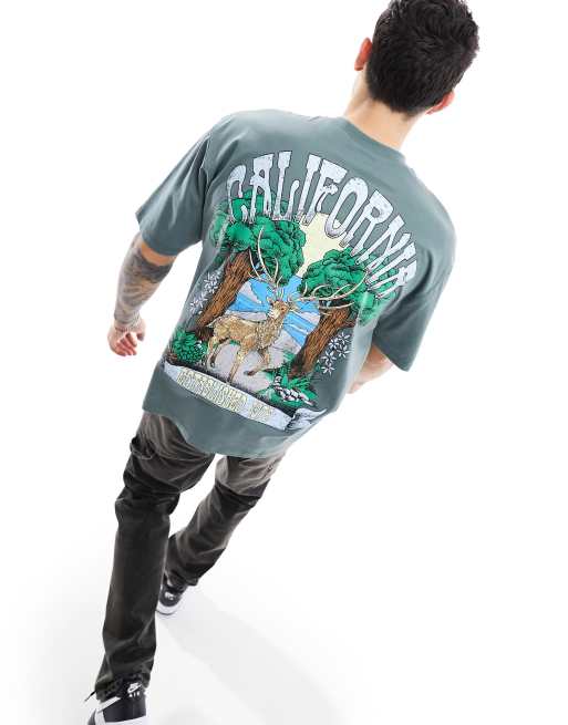 FhyzicsShops DESIGN - T-shirt oversize verde con stampa di paesaggio sul retro