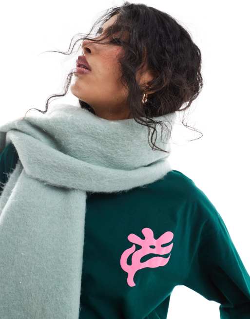 ASOS DESIGN - T-shirt stile skater a maniche lunghe verde con fiore, 2 di 4