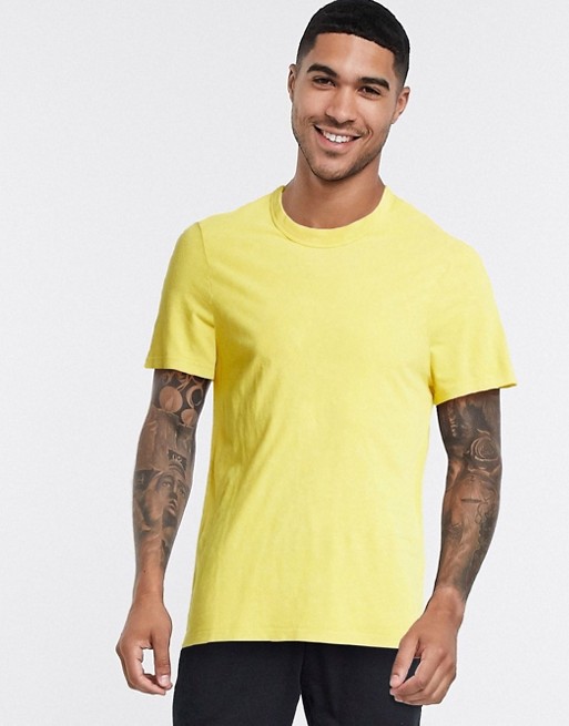 ASOS DESIGN t-shirt with acid wash in yellow