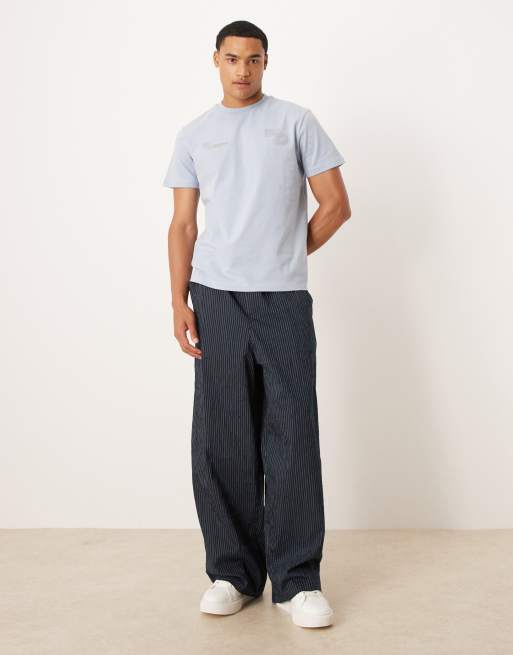 ASOS DESIGN t-shirt with high build text graphic in light blue | ASOS