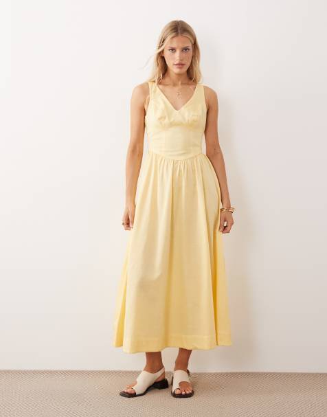 ASOS DESIGN – Tailliertes Maxikleid in Buttergelb mit V-Ausschnitt und Ziernaht - view 1