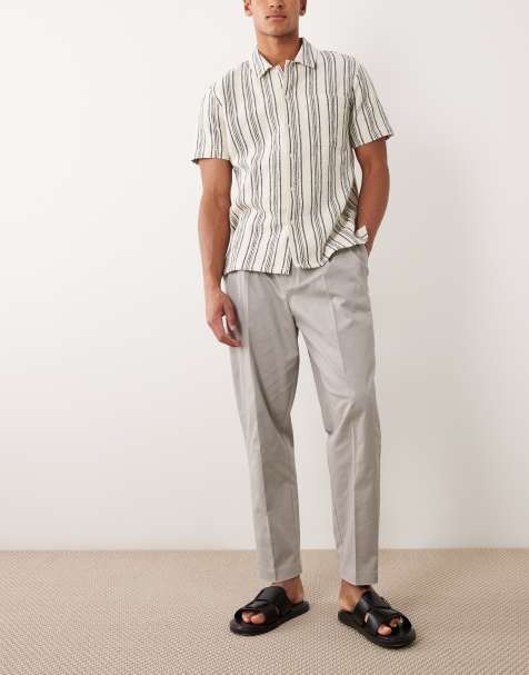 ASOS DESIGN tailored cotton rich relaxed tapered chino pants in grey with front pleats - view 1