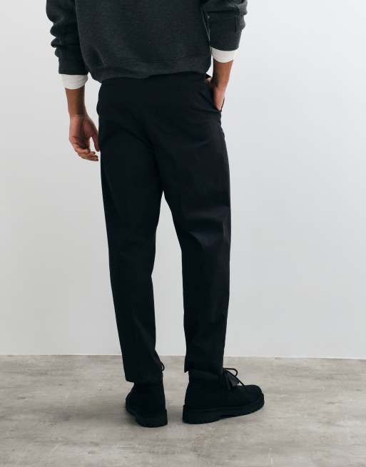 ASOS DESIGN tailored cotton rich relaxed tapered chino trousers in black with coin pocket, 2 of 5