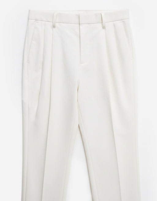 ASOS DESIGN tailored cotton rich relaxed tapered chino trousers in ecru with front pleats, 8 of 12