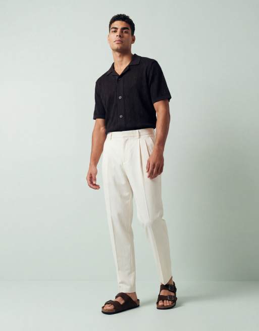 ASOS DESIGN tailored cotton rich relaxed tapered chino trousers in ecru with front pleats, 9 of 12