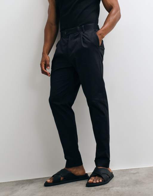ASOS DESIGN tailored cotton rich tapered chino trousers in black with turnup, 2 of 5