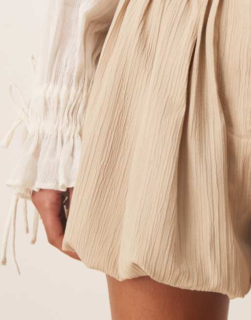 ASOS DESIGN tailored crinkle bubble hem shorts in stone