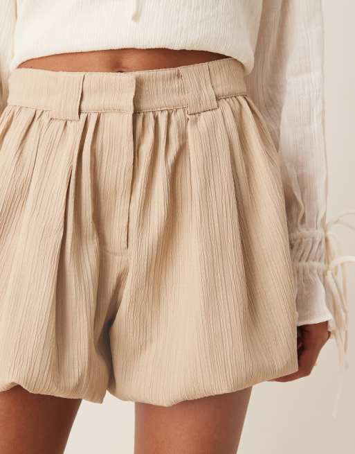 ASOS DESIGN tailored crinkle bubble hem shorts in stone