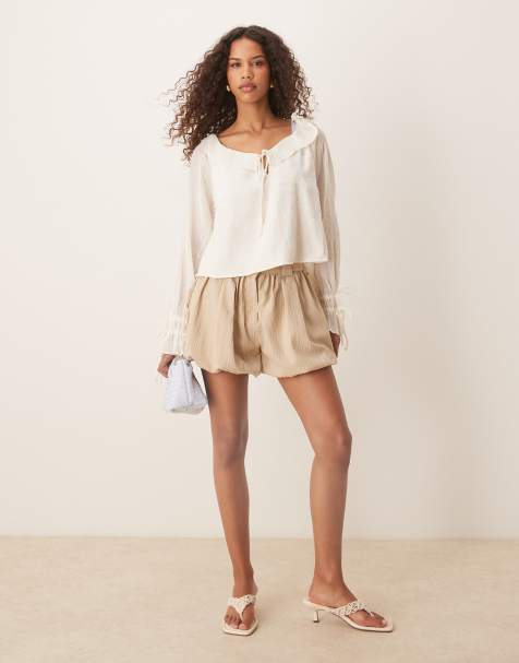 ASOS DESIGN tailored crinkle puffball hem shorts in stone - view 1