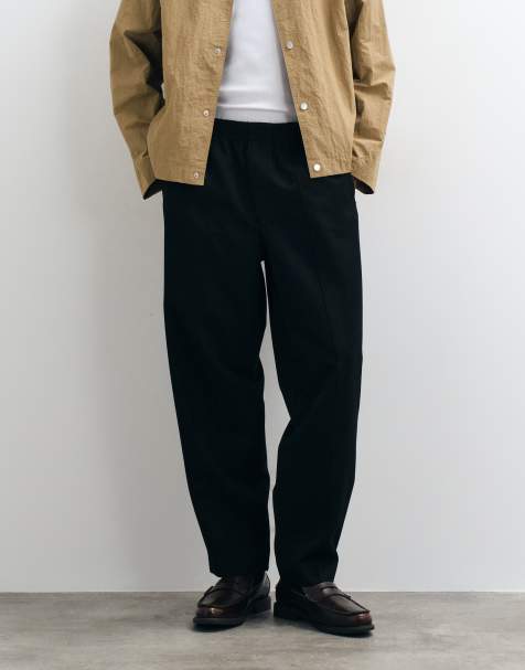 ASOS DESIGN tailored elasticated oversized tapered trousers in black - view 1