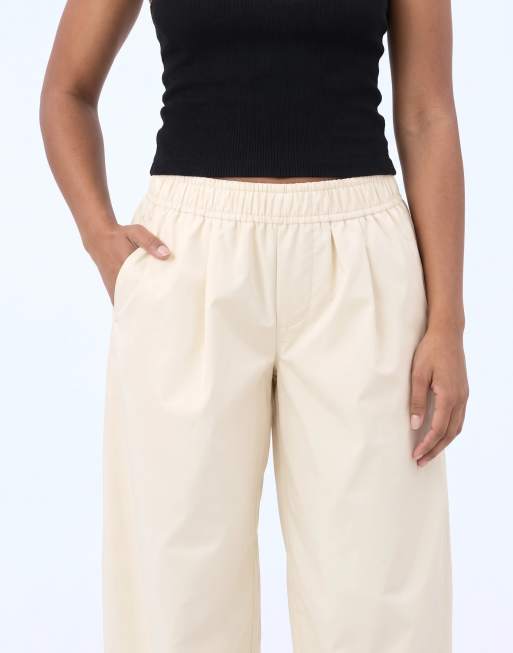 ASOS DESIGN Tailored faux leather tapered trousers in cream, 10 of 10