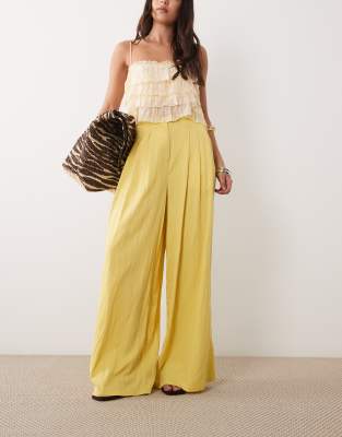 ASOS DESIGN Tailored floaty skinny waistband triple pleat trousers in yellow