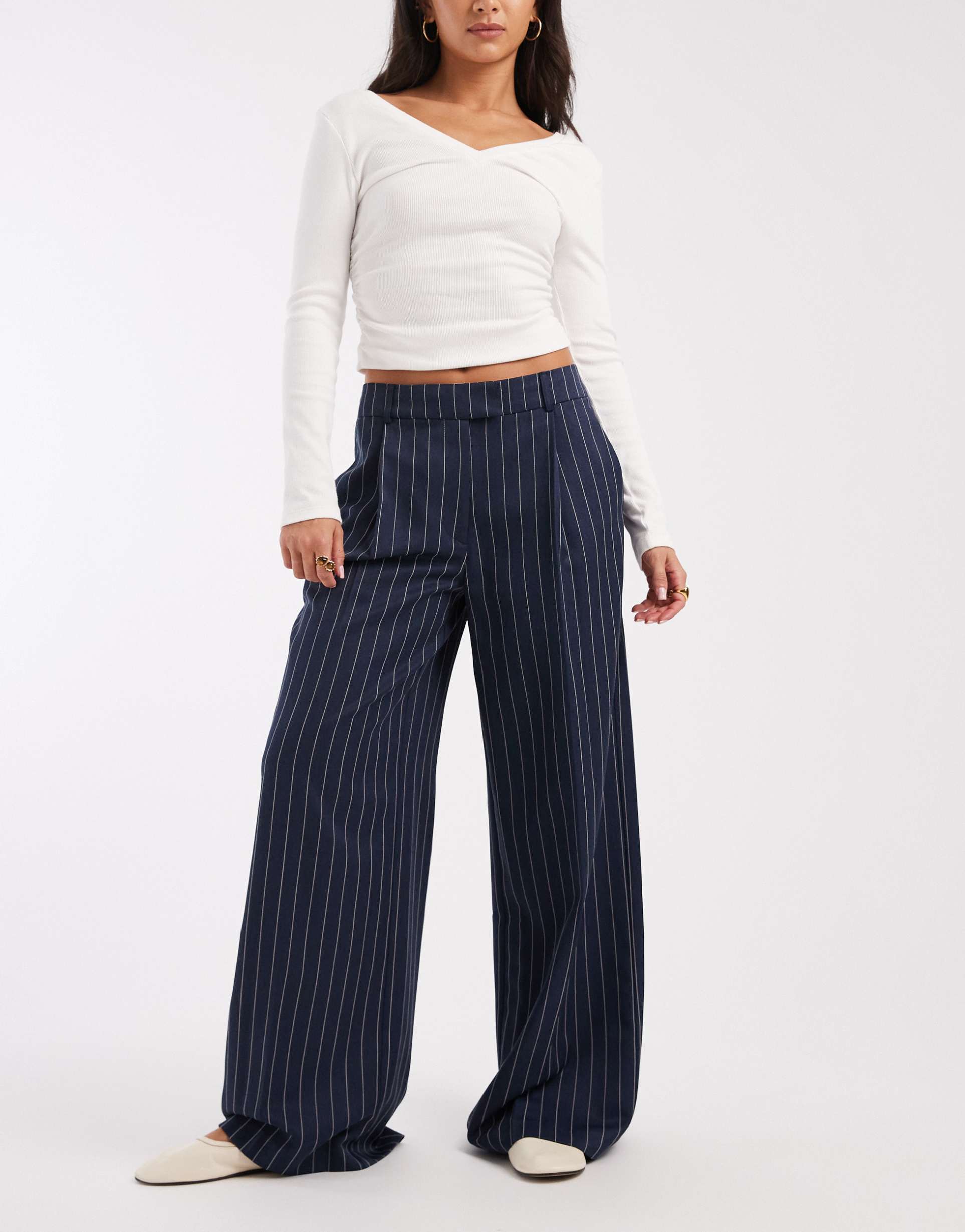 asos design tailored low rise wide leg mansy pants in navy pinstripe