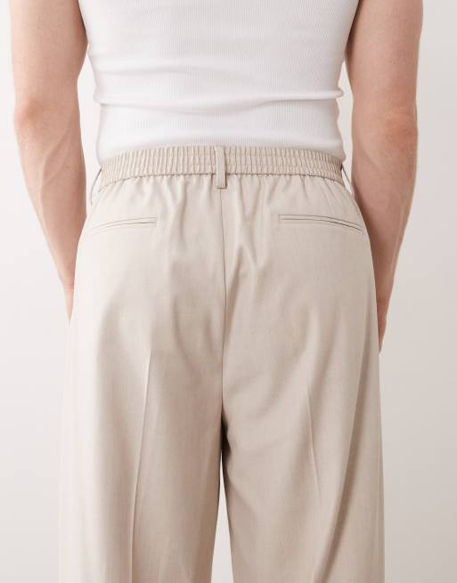 ASOS DESIGN tailored oversized tapered trousers with elasticated waist in stone, 4 of 5