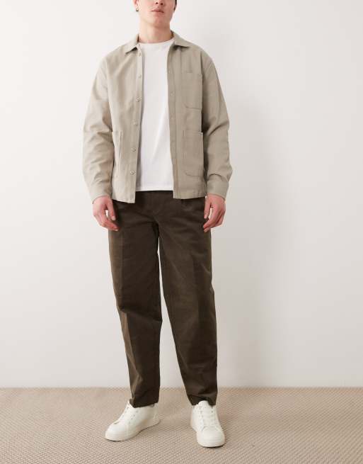 ASOS DESIGN tailored pleated cotton rich oversized tapered pants in brown corduroy