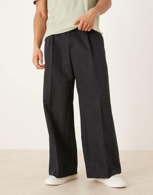 ASOS DESIGN tailored pleated linen rich loose leg trousers in black