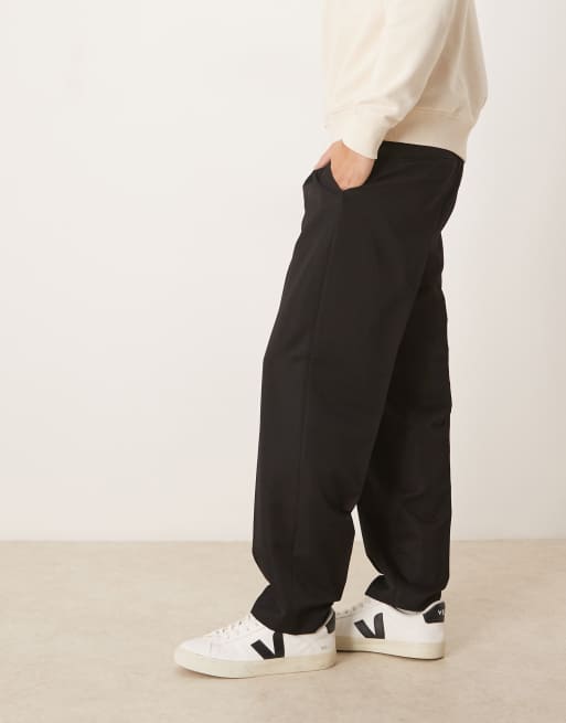 ASOS DESIGN tailored pleated relaxed tapered pants with elastic waistband in black, 3 of 5