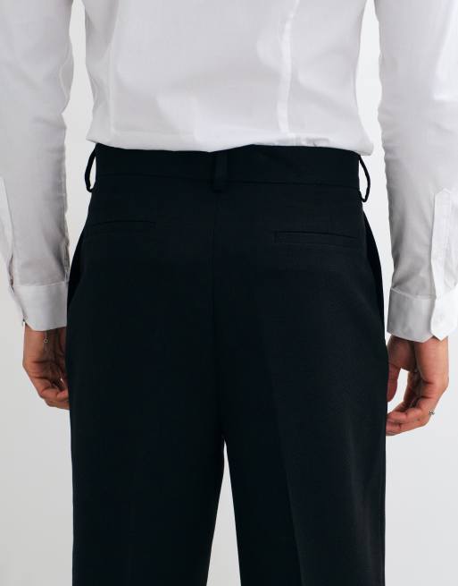 ASOS DESIGN tailored pleated relaxed tapered trousers in black microtexture, 4 of 5