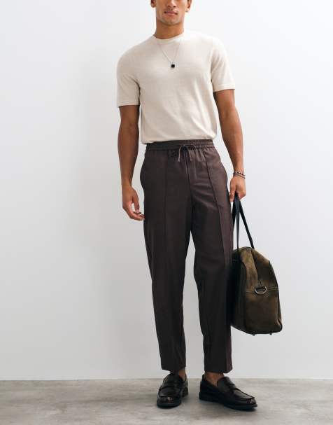 ASOS DESIGN tailored pull on flannel relaxed tapered trousers in navy - view 1