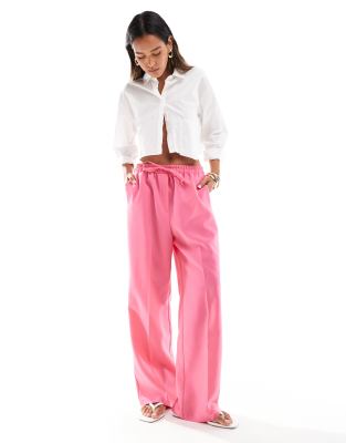 ASOS DESIGN tailored pull on trousers in pink