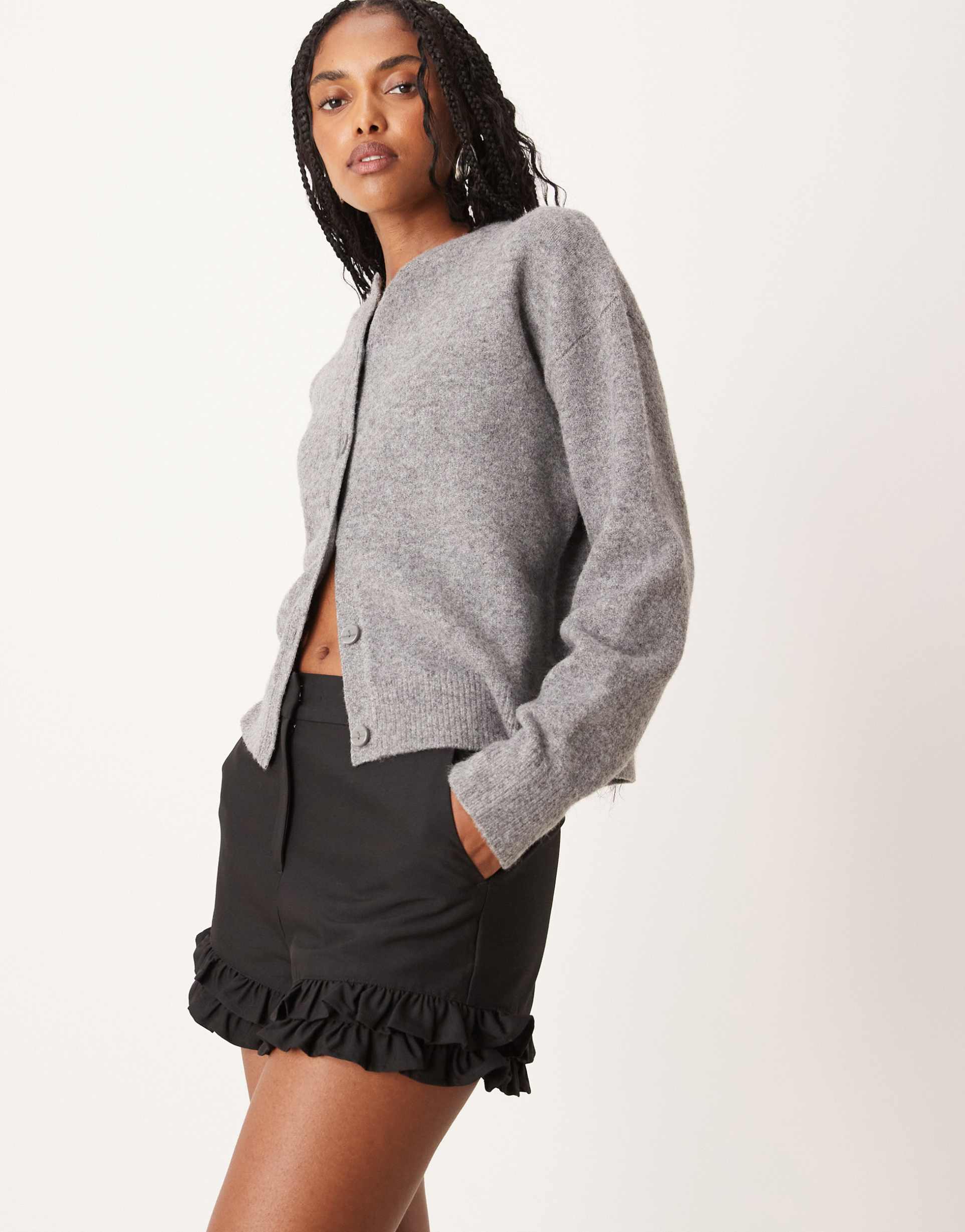 asos design tailored ruffle hem shorts in black