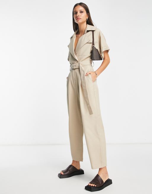 ASOS DESIGN textured halter jumpsuit with belt and large pocket in