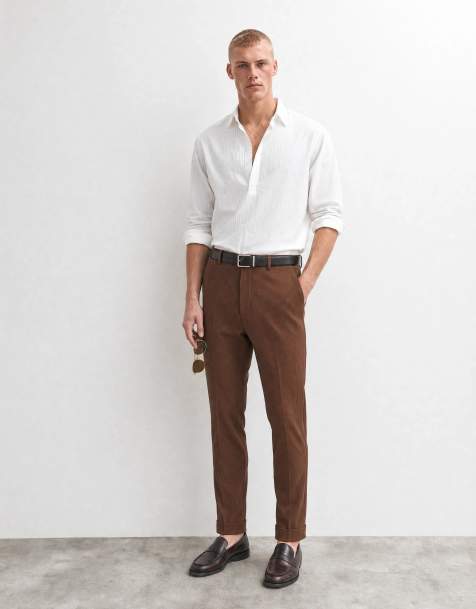 ASOS DESIGN tailored tapered comfort ribbed trousers in brown with turnup - view 1