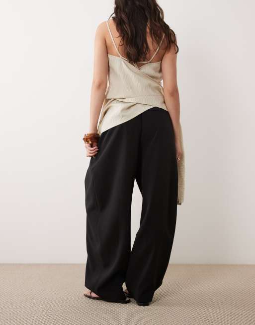 ASOS DESIGN Tailored tapered pants with snap hem detail in black, 5 of 5