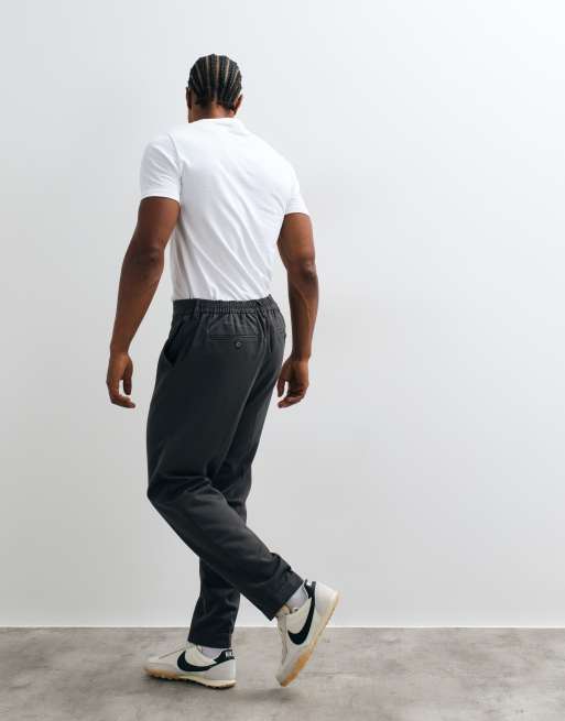 ASOS DESIGN tailored tapered trousers in charcoal with elasticated waist and turnup, 4 of 5