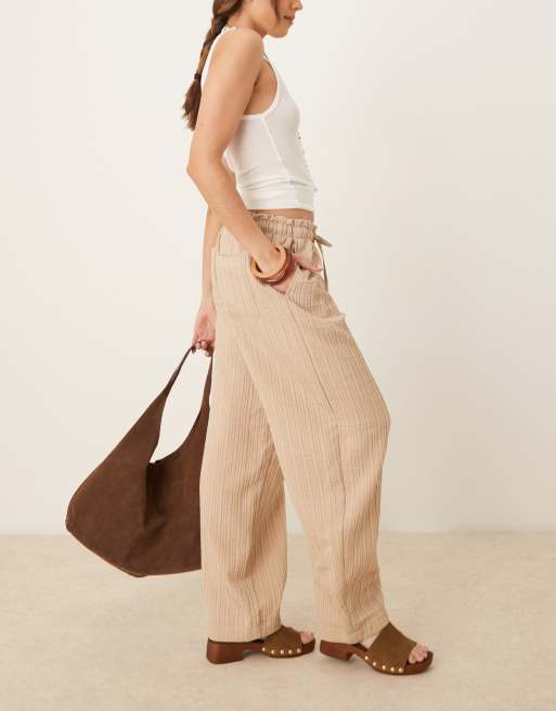 ASOS DESIGN tailored textured drawstring waist arched-leg pants in stone, 2 of 5