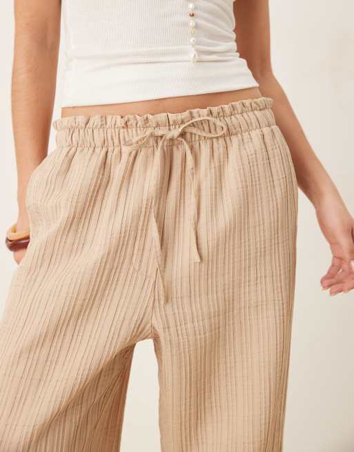 ASOS DESIGN tailored textured drawstring waist arched-leg pants in stone, 3 of 5