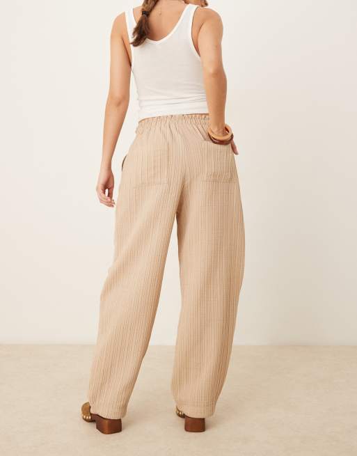 ASOS DESIGN tailored textured drawstring waist arched-leg pants in stone, 4 of 5