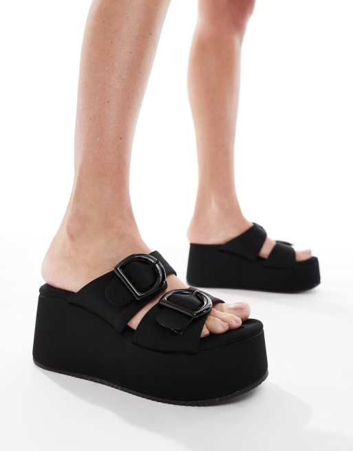 ASOS DESIGN Take Over buckle detail flatform mules in black ASOS