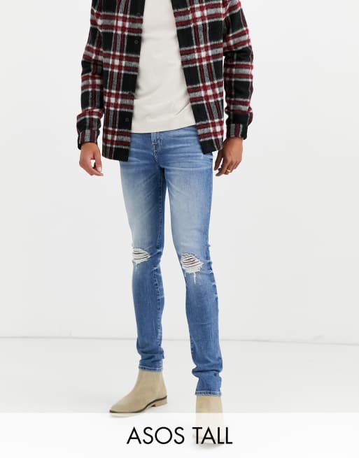 ASOS DESIGN Tall 12.5oz super skinny jeans in mid wash blue with busted knees