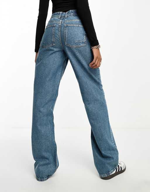 ASOS DESIGN Tall flared jeans in mid blue