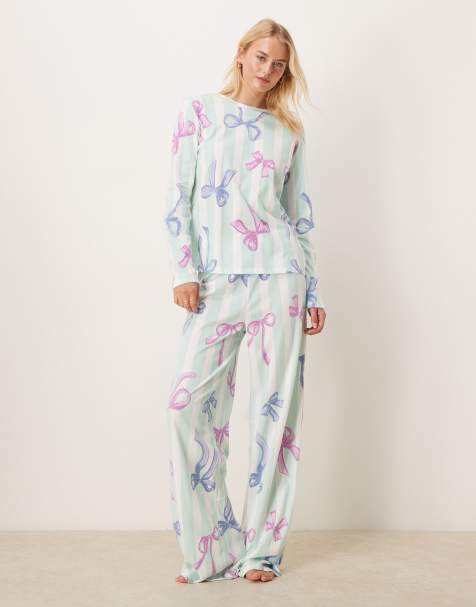 ASOS DESIGN Tall Christmas bow long sleeve top & trouser pyjama set in blue stripe - view 1