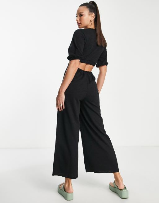 ASOS DESIGN tall deep v jumpsuit with puff sleeve in black