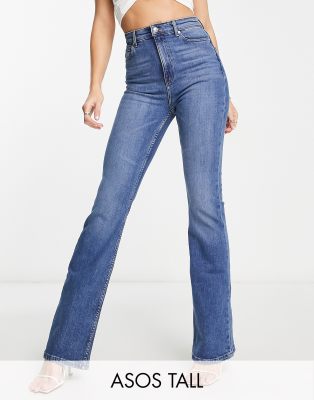 New Look Tall flared jeans in mid blue - ShopStyle