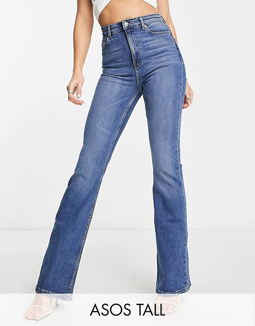 ASOS DESIGN Tall flared jeans in mid blue | ASOS