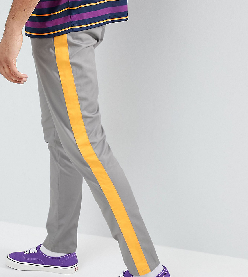 ASOS DESIGN – Tall – Grå avsmalnande byxor med gula sidoränder