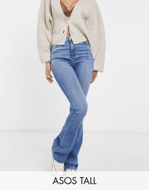 ASOS DESIGN Tall flared jeans in mid blue