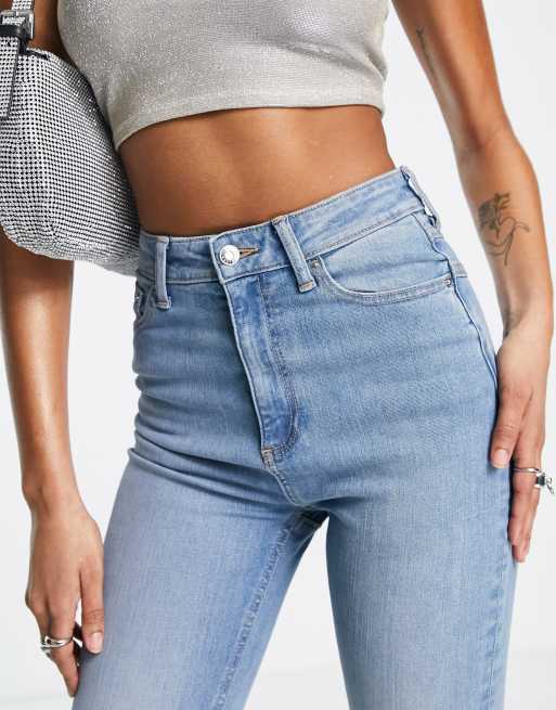 ASOS DESIGN Tall high rise 'lift and contour' stretch flare jeans in mid  blue