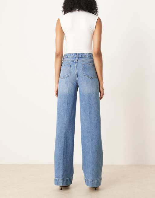 ASOS DESIGN Tall high rise wide leg jeans with front pockets in mid blue