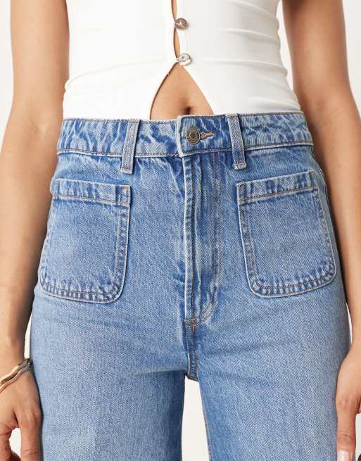 ASOS DESIGN Tall high rise wide leg jeans with front pockets in mid blue