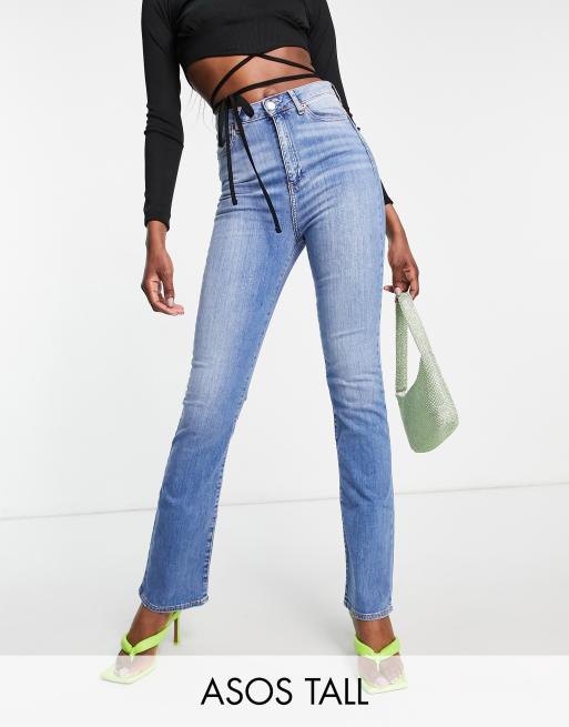 ASOS DESIGN low rise flare jean with belt in mid wash blue