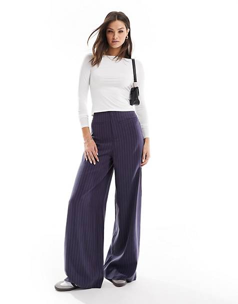 high low side slit pinstripe sweater and flowy winter white wide leg  trousers